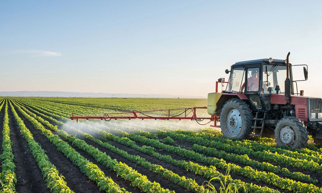 Tractor Spraying Soybean Field